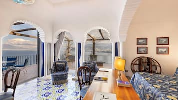 Deluxe Suite, Sea View | Premium bedding, minibar, in-room safe, desk