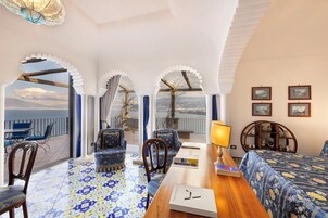 Deluxe Suite, Sea View | Premium bedding, minibar, in-room safe, desk