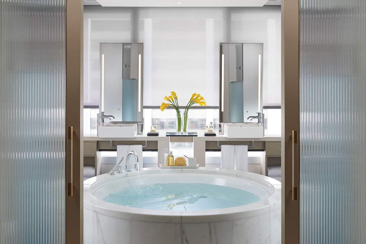 separate bathtub and shower, deep-soaking bathtub, rainfall showerhead