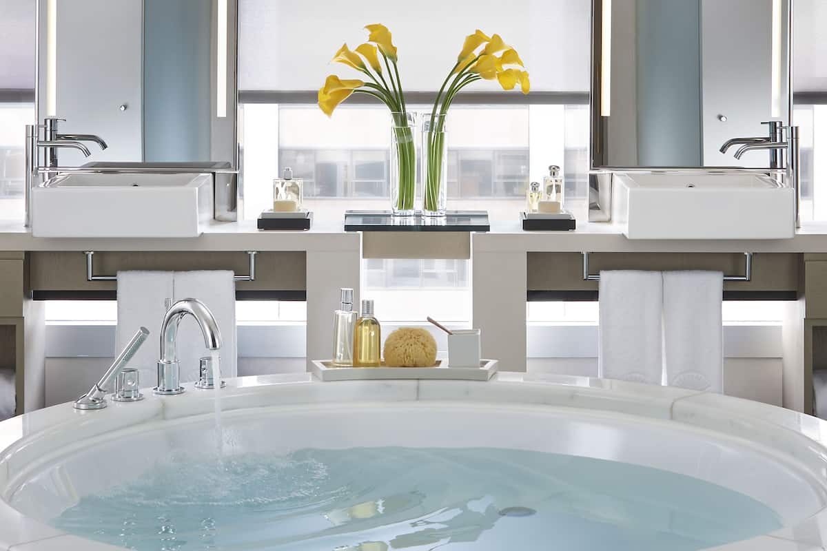 separate bathtub and shower, deep-soaking bathtub, rainfall showerhead