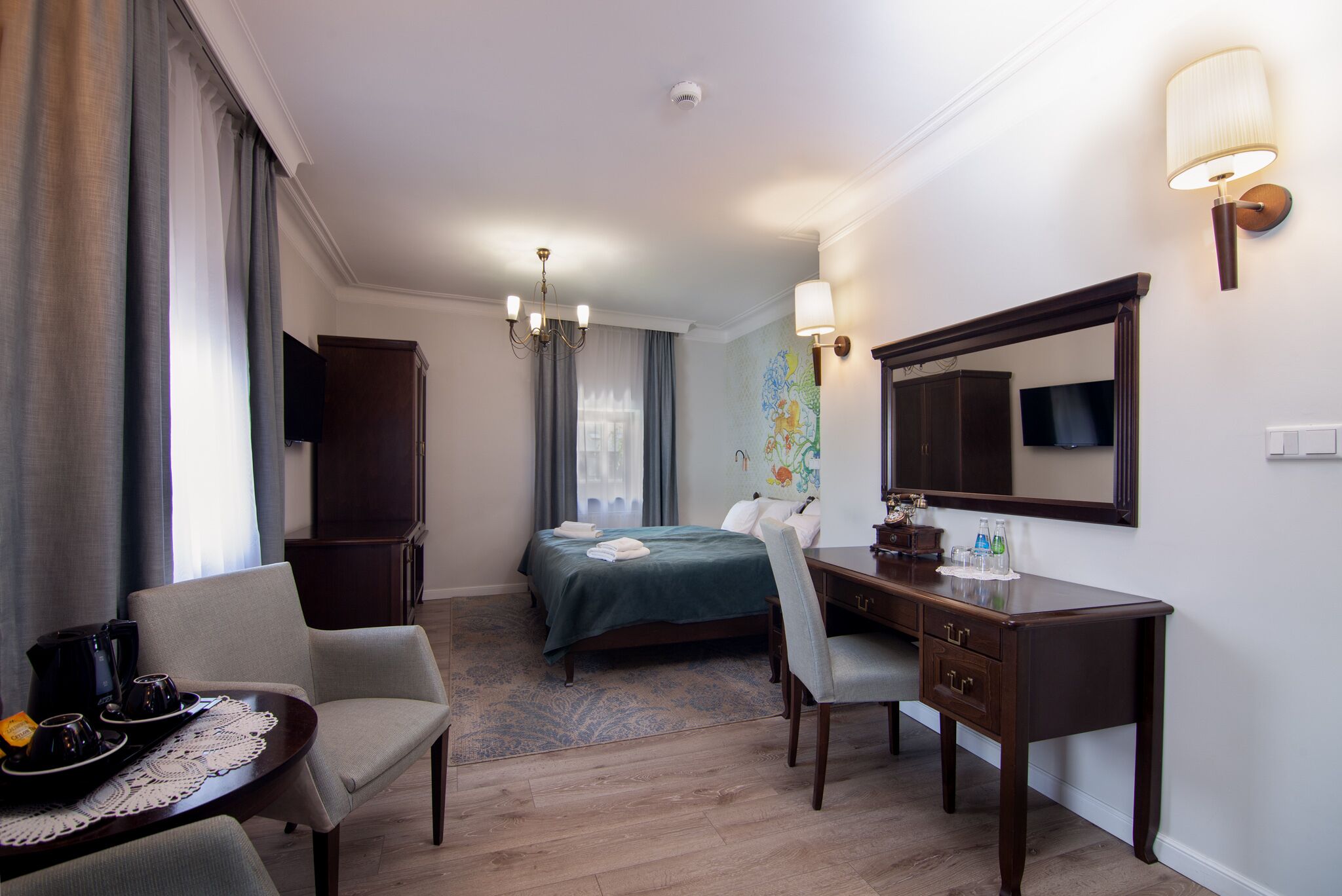 deluxe double room | living area | lcd tv