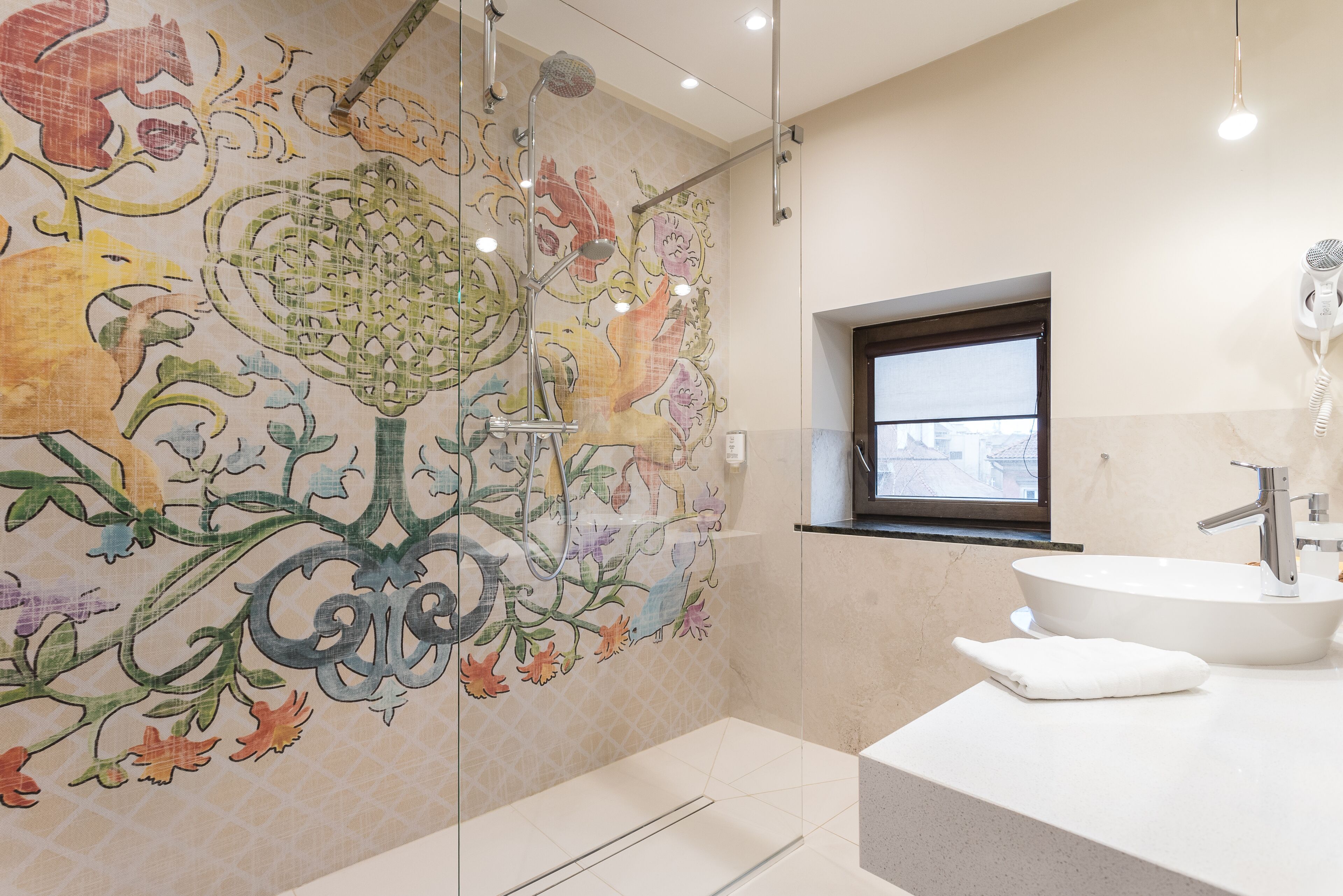 designer toiletries, hair dryer, towels