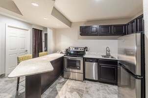 Standard Suite, Multiple Beds, Non Smoking, Kitchen | In-room safe, desk, laptop workspace, iron/ironing board