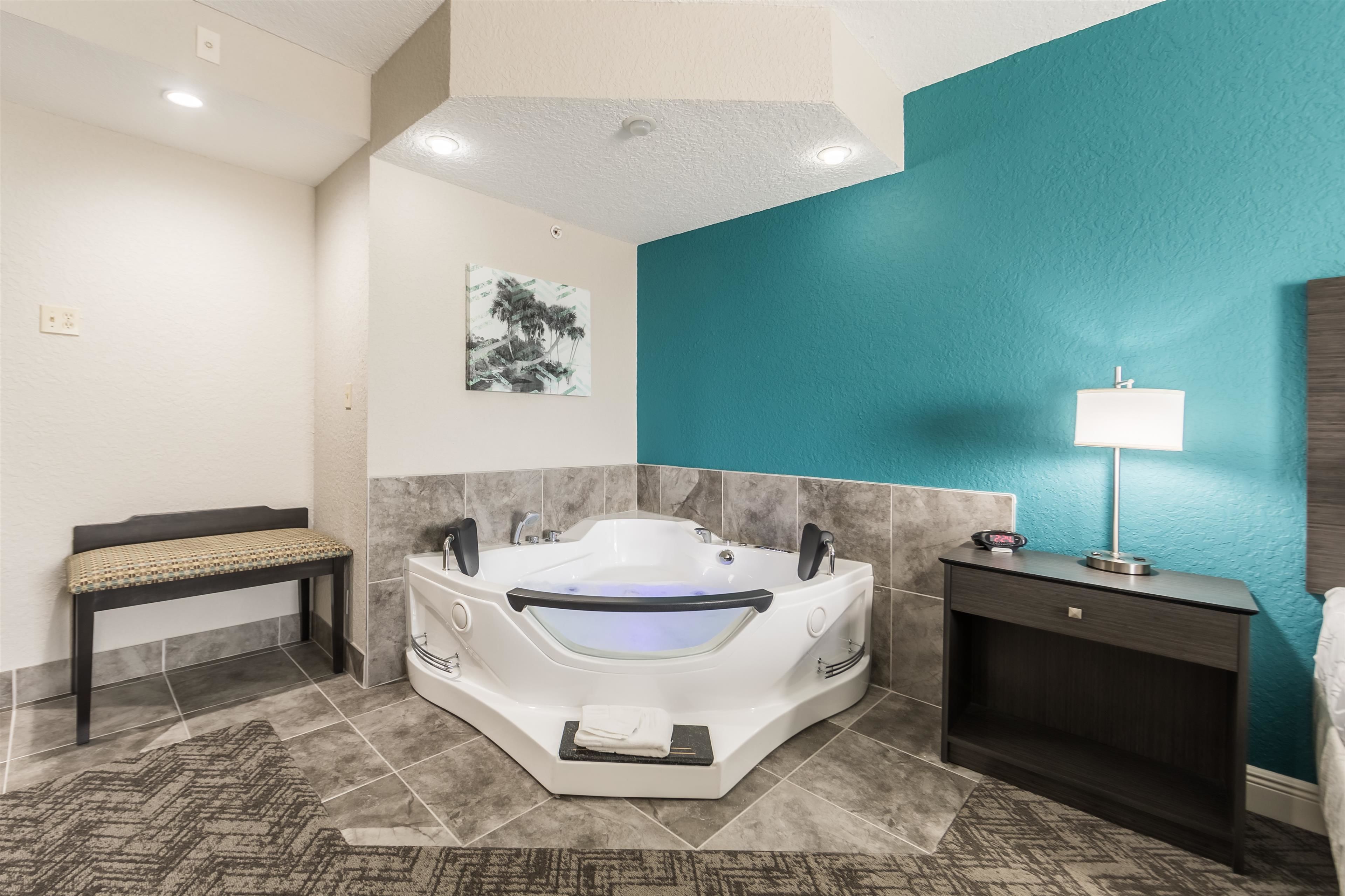 suite, 1 king bed, non smoking, jetted tub | in-room safe, desk, laptop workspace, iron/ironing board