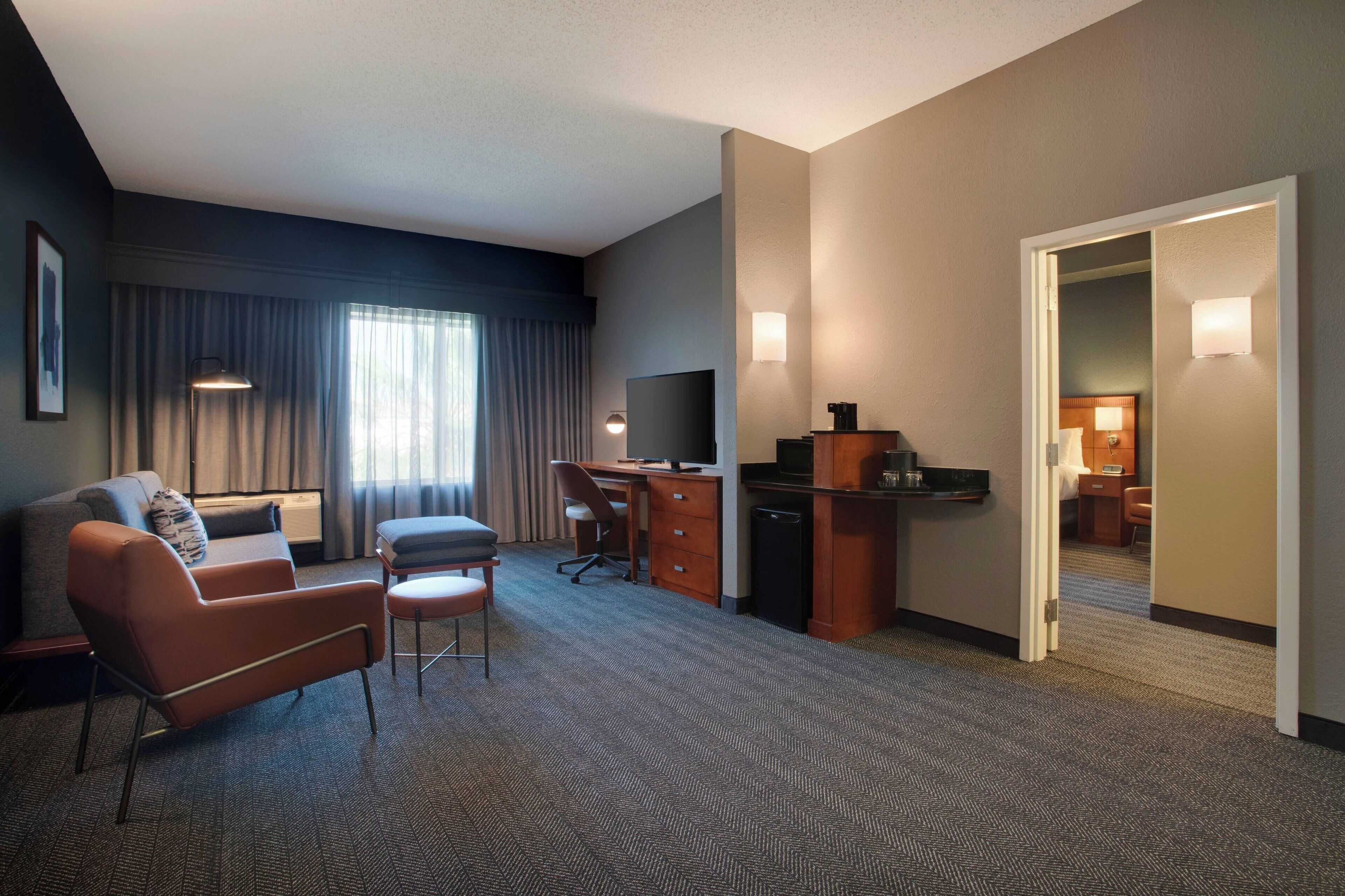 premium bedding, desk, blackout curtains, iron/ironing board