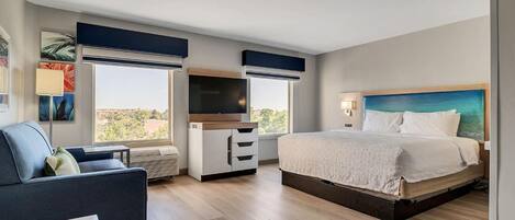 Ropa de cama de alta calidad y caja de seguridad en la habitación