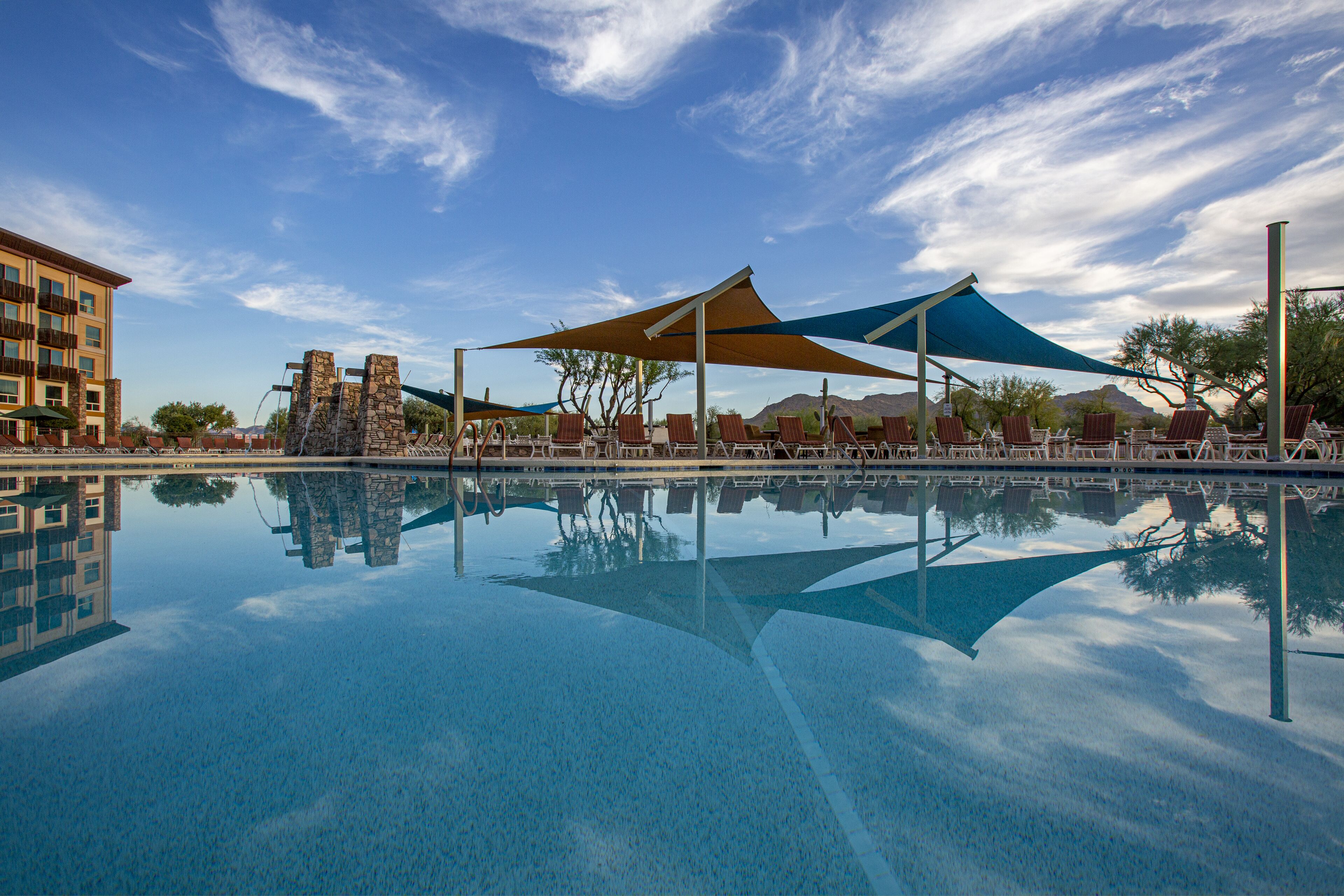 Outdoor pool, open 7:00 AM to 11:00 PM, pool umbrellas, sun loungers