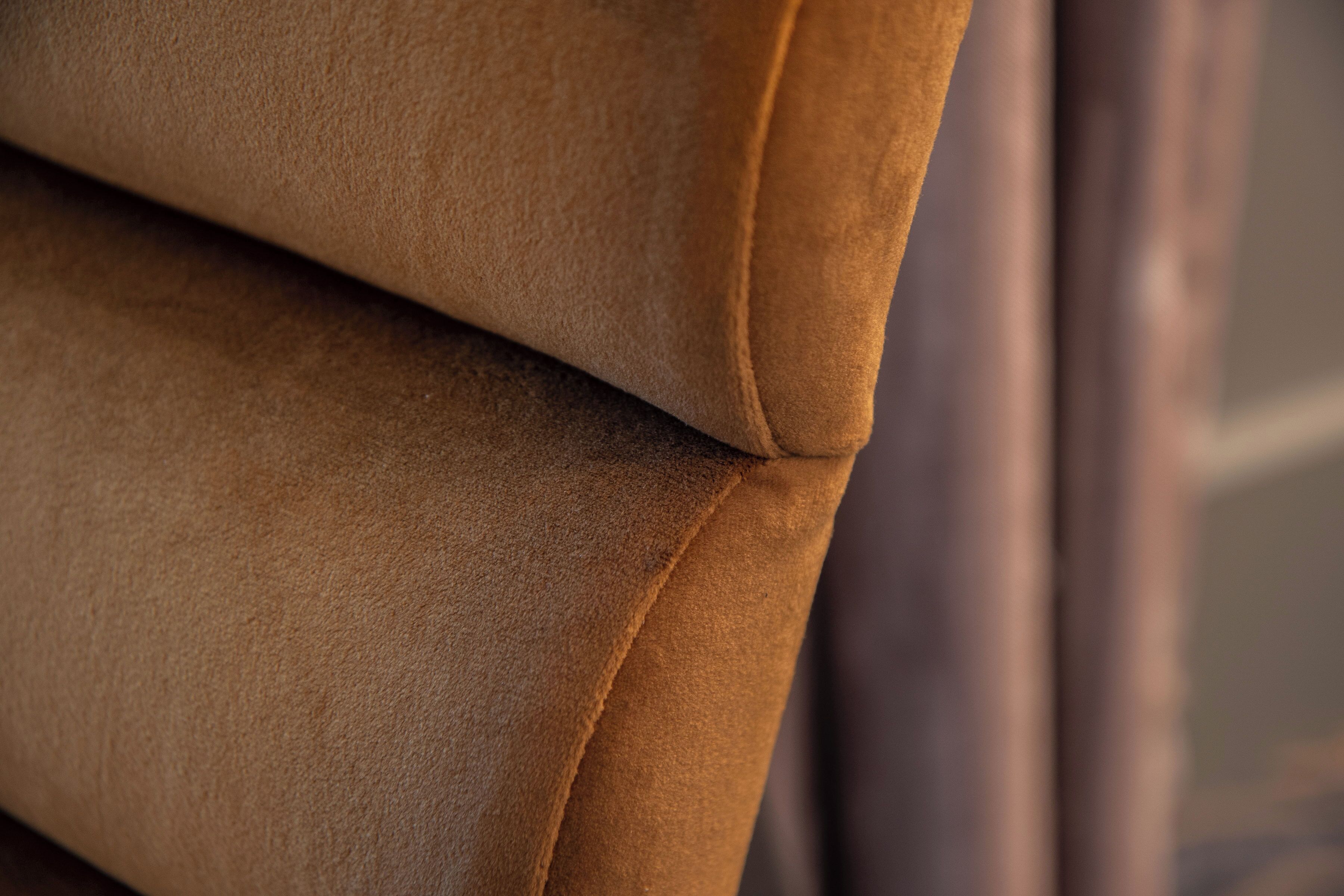 A close-up of a textured fabric, likely part of a piece of furniture.