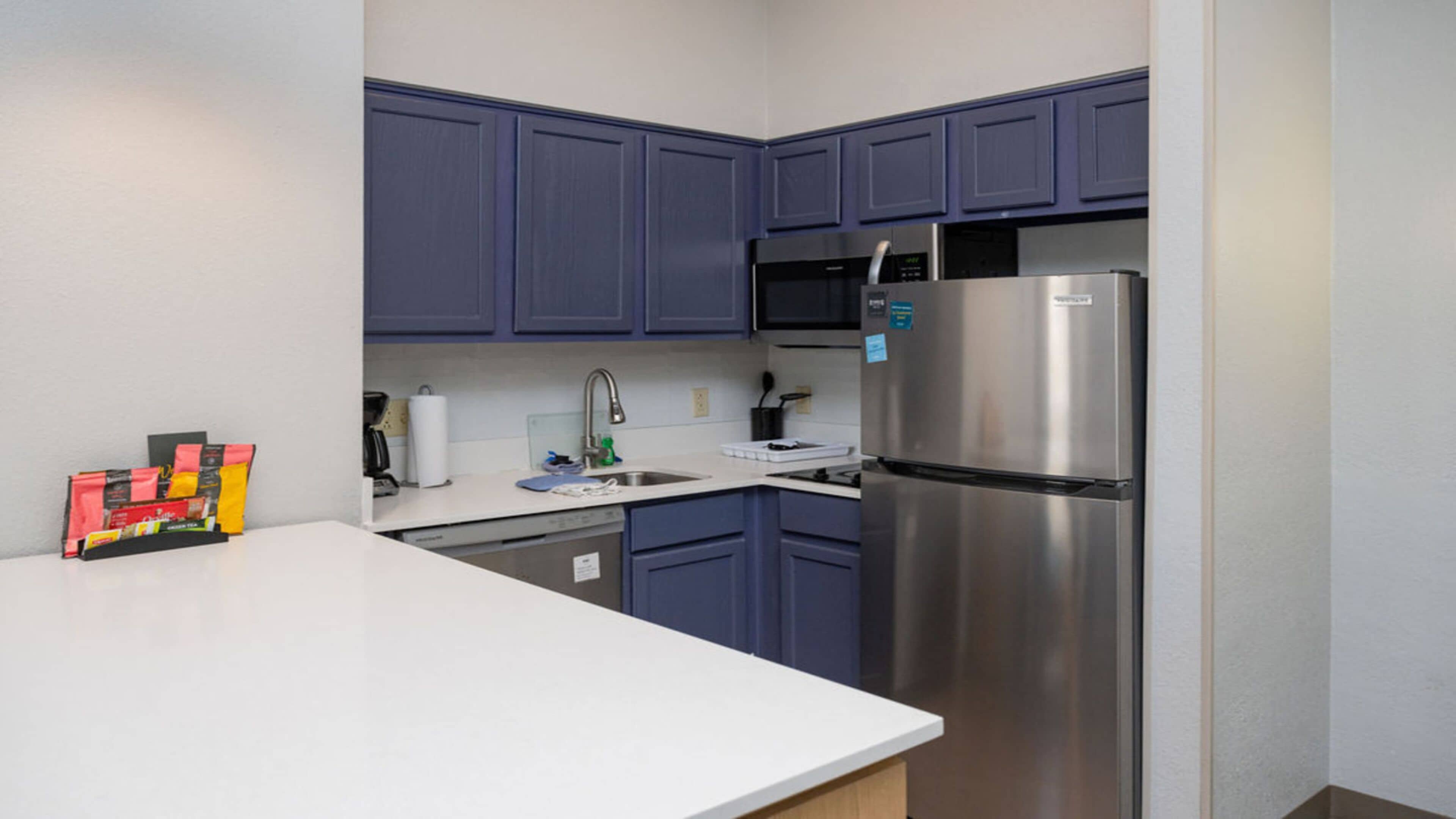 suite, 1 bedroom, kitchen (living & dining area) | private kitchen | fridge, microwave, stovetop, dishwasher