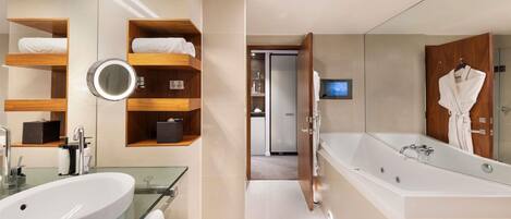 A modern bathroom with a glass-enclosed sink, wooden shelves, a large mirror, and a walk-in shower.