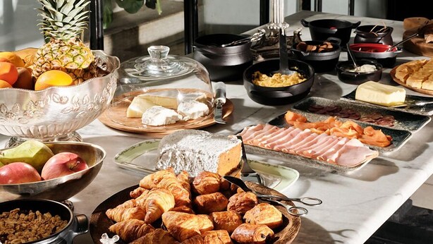 A breakfast buffet with various food items and a chandelier. - The Twentyone (Kifisia)