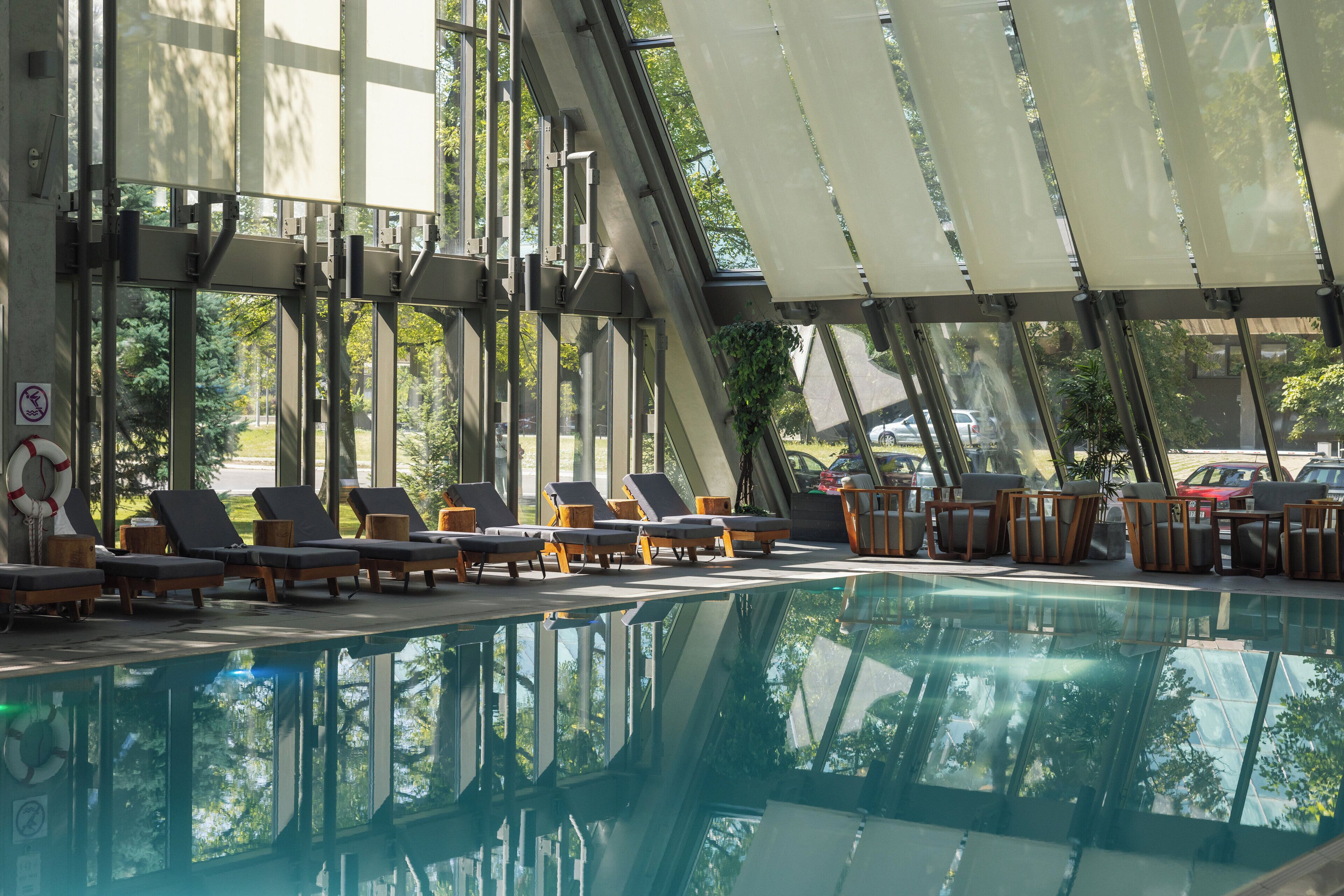 indoor pool, open 6:30 am to 10 pm, pool umbrellas, pool loungers