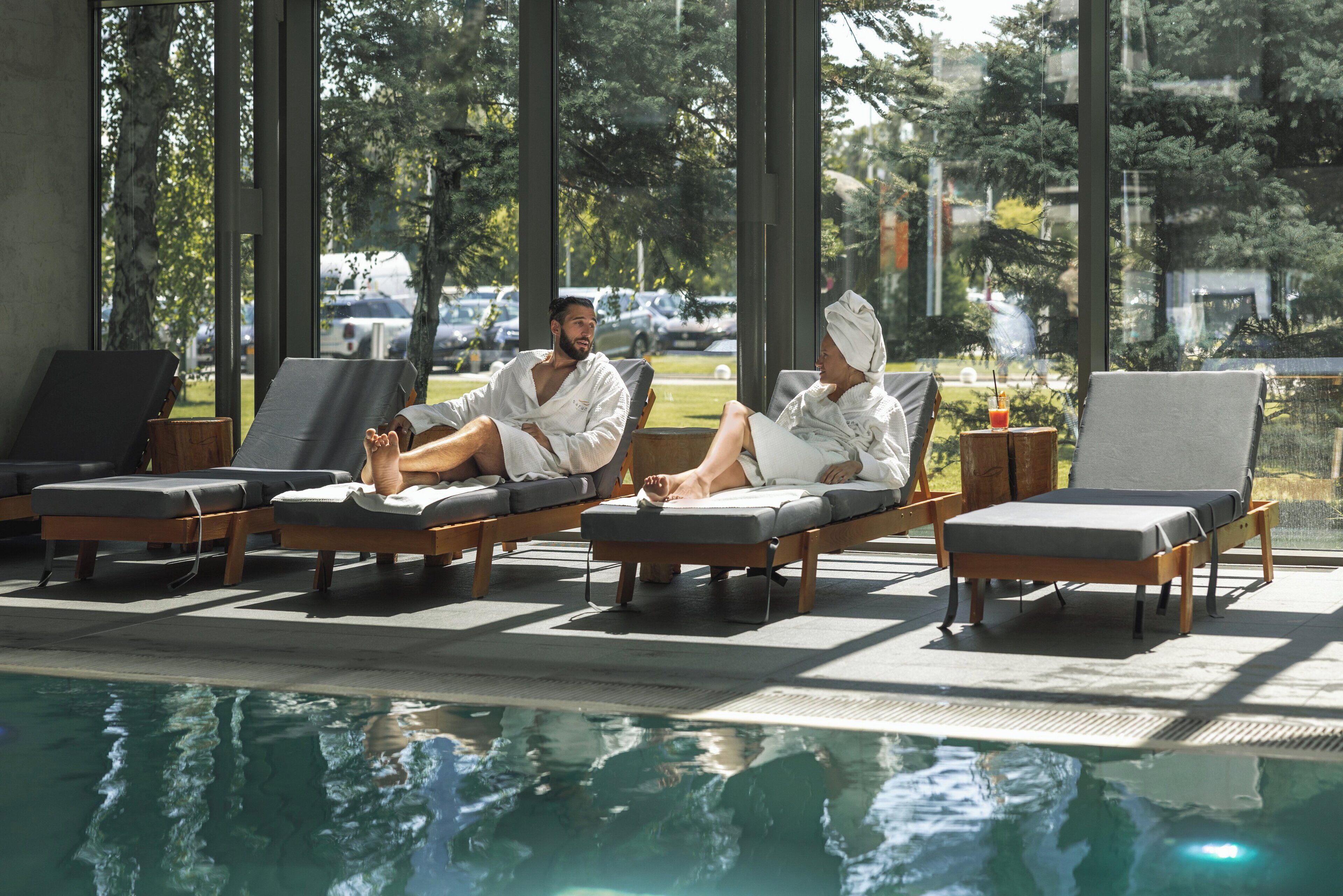 indoor pool, open 6:30 am to 10 pm, pool umbrellas, pool loungers