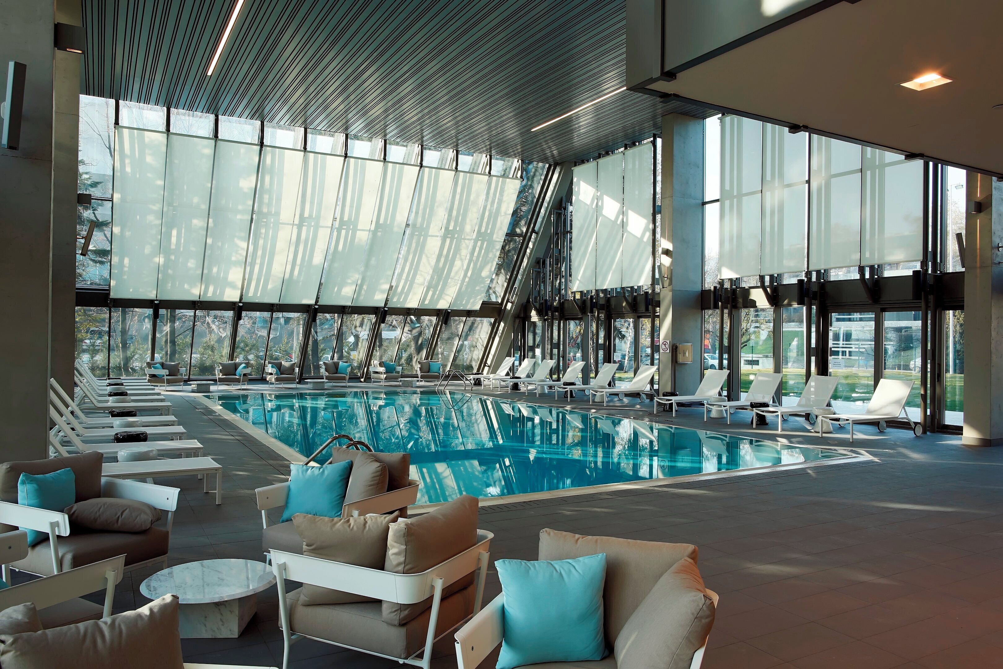 Indoor pool, open 6:30 AM to 10 PM, pool umbrellas, sun loungers