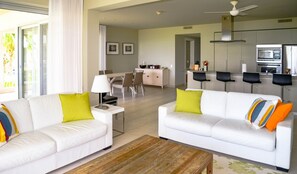 Corner Suite, 1 Bedroom, Oceanfront | Living area - Le Vele Resort (Providenciales)