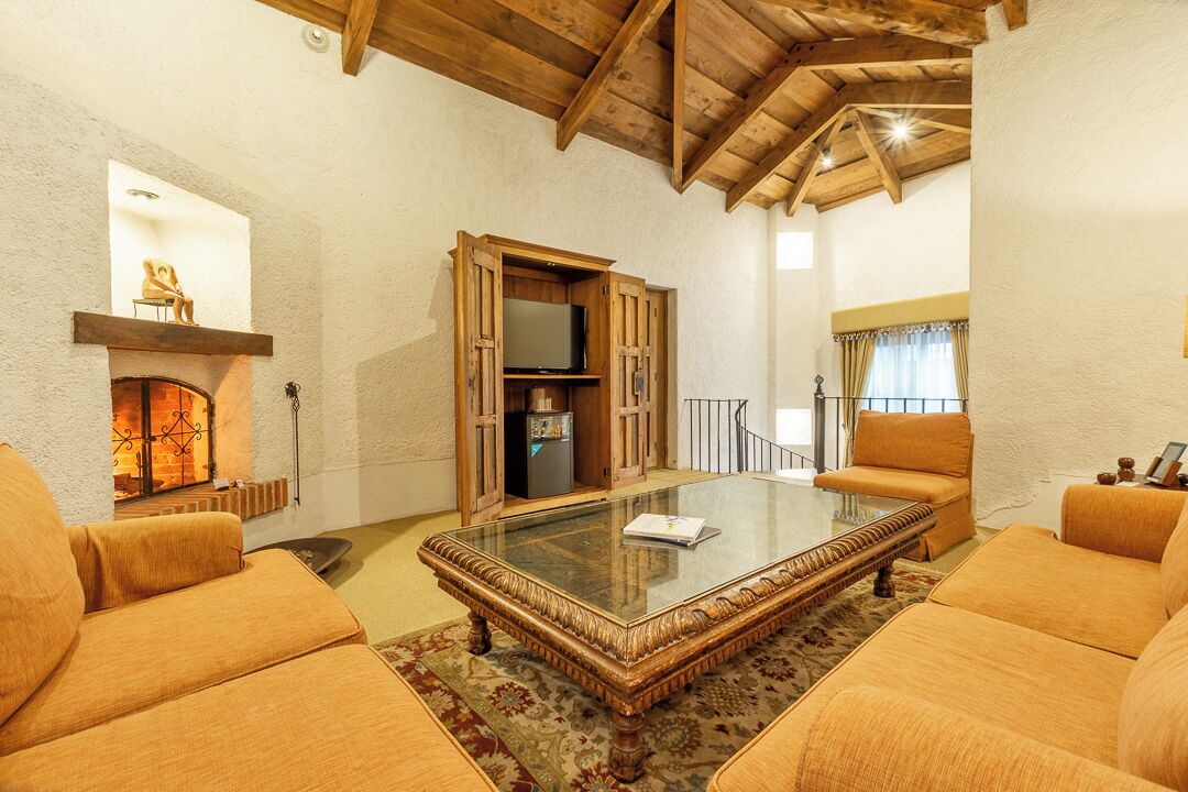 executive suite, 1 king bed (all rooms are different) | living area | 42-inch smart tv with cable channels, tv, fireplace