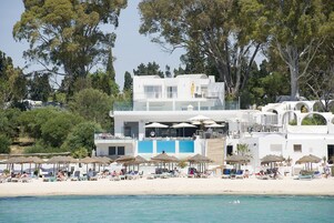 Private beach, white sand, sun loungers, beach umbrellas