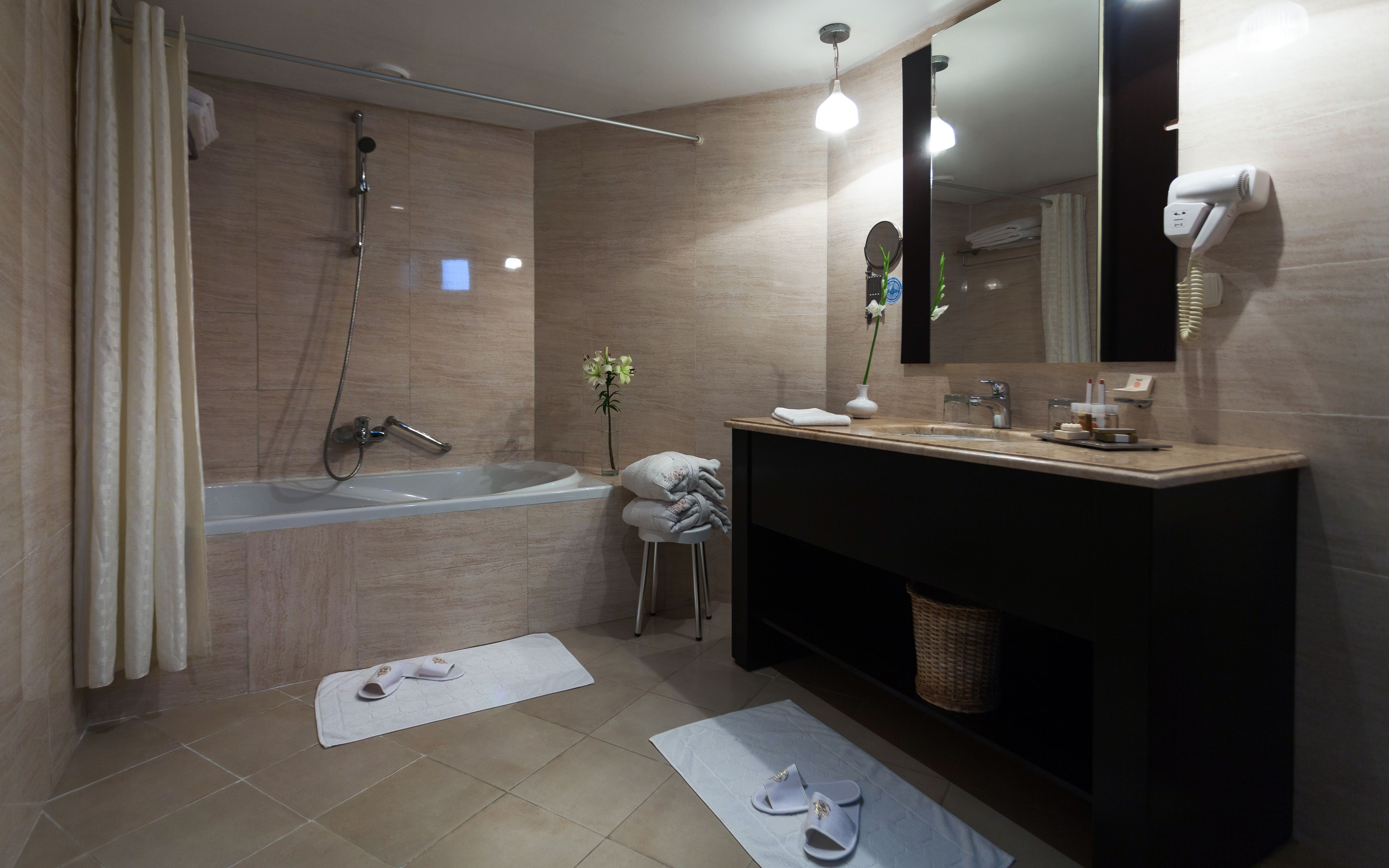 twin room | bathroom | separate bathtub and shower, free toiletries, hair dryer, slippers