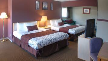 Two single beds with matching headboards and footboards, a nightstand, and a desk with a chair.