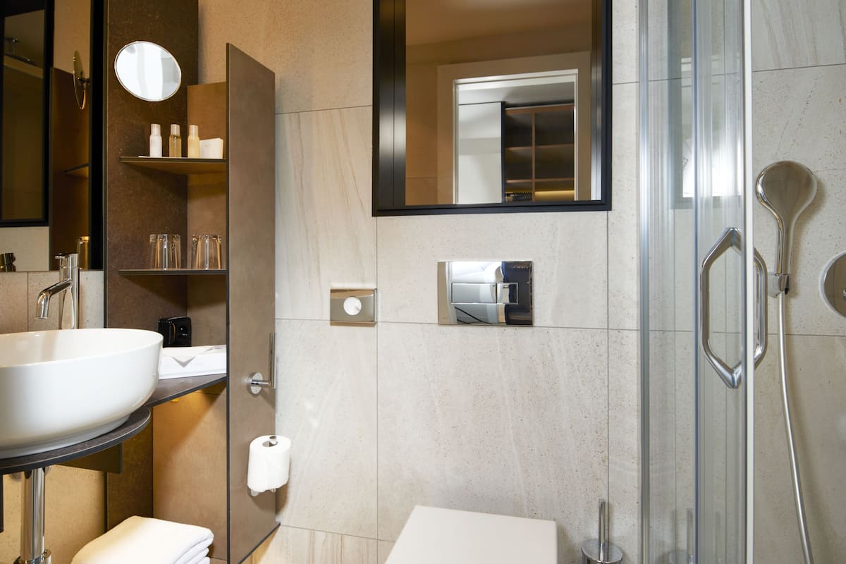 shower, hair dryer, bathrobes, slippers