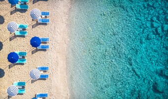 On the beach, sun loungers, beach umbrellas, beach towels