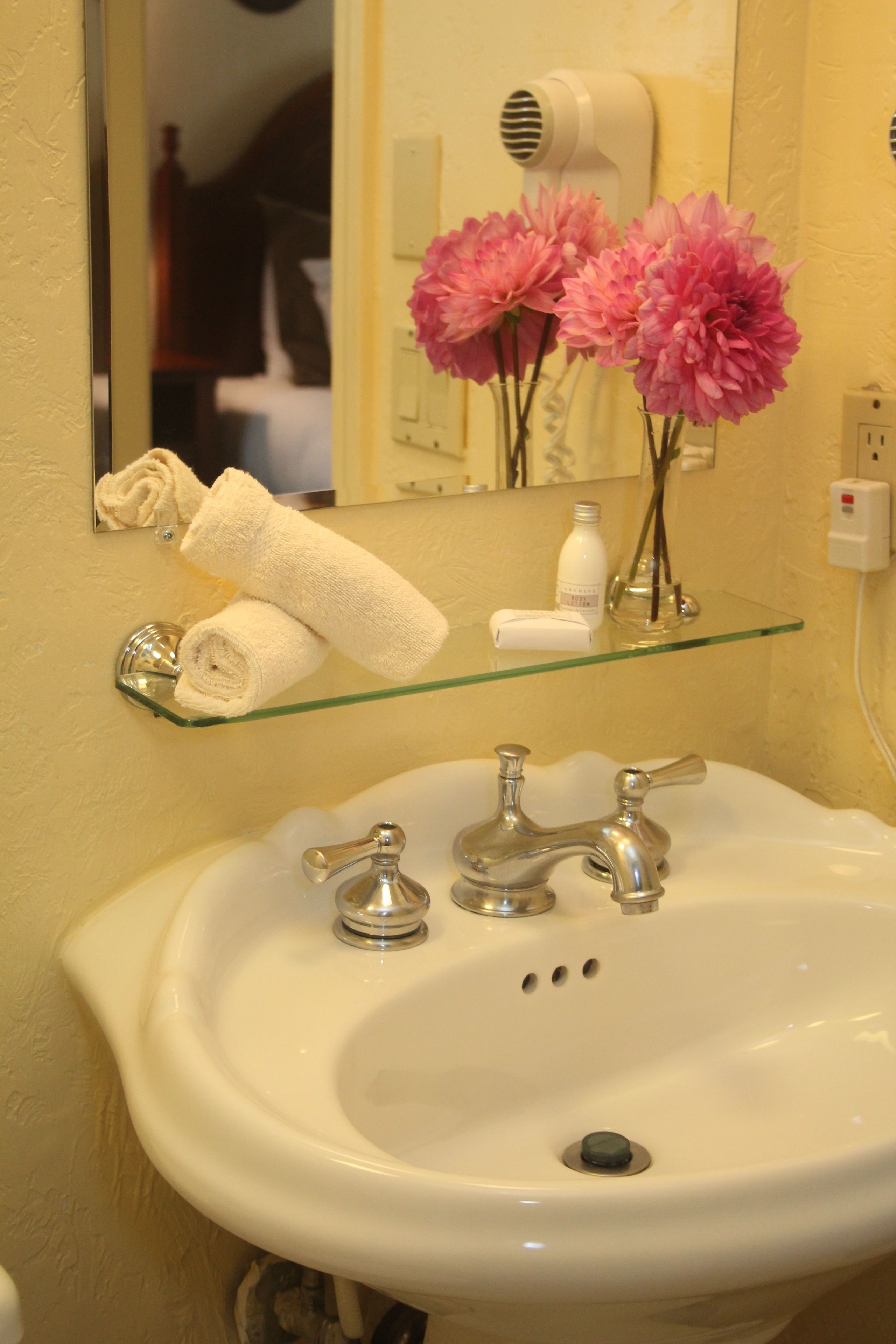 combined shower/bathtub, designer toiletries, hair dryer, towels