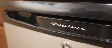 A close-up of a kitchen appliance with the brand name "Frigidaire" visible.