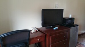 Premium bedding, desk, laptop workspace, blackout drapes