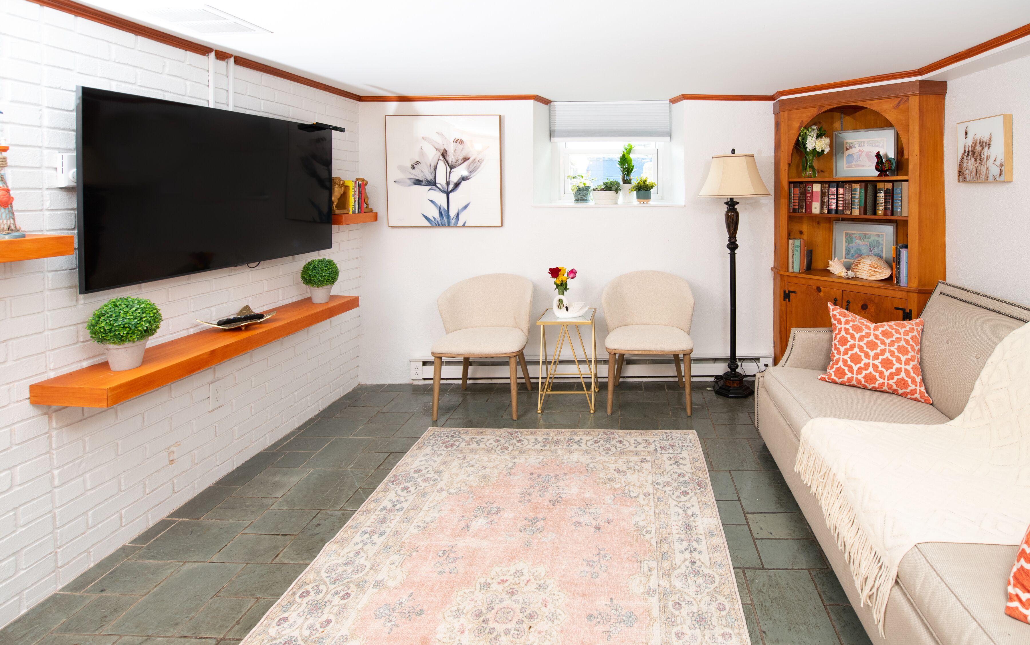 basement apartment (pet friendly) | living area | 45-inch plasma tv with cable channels, tv