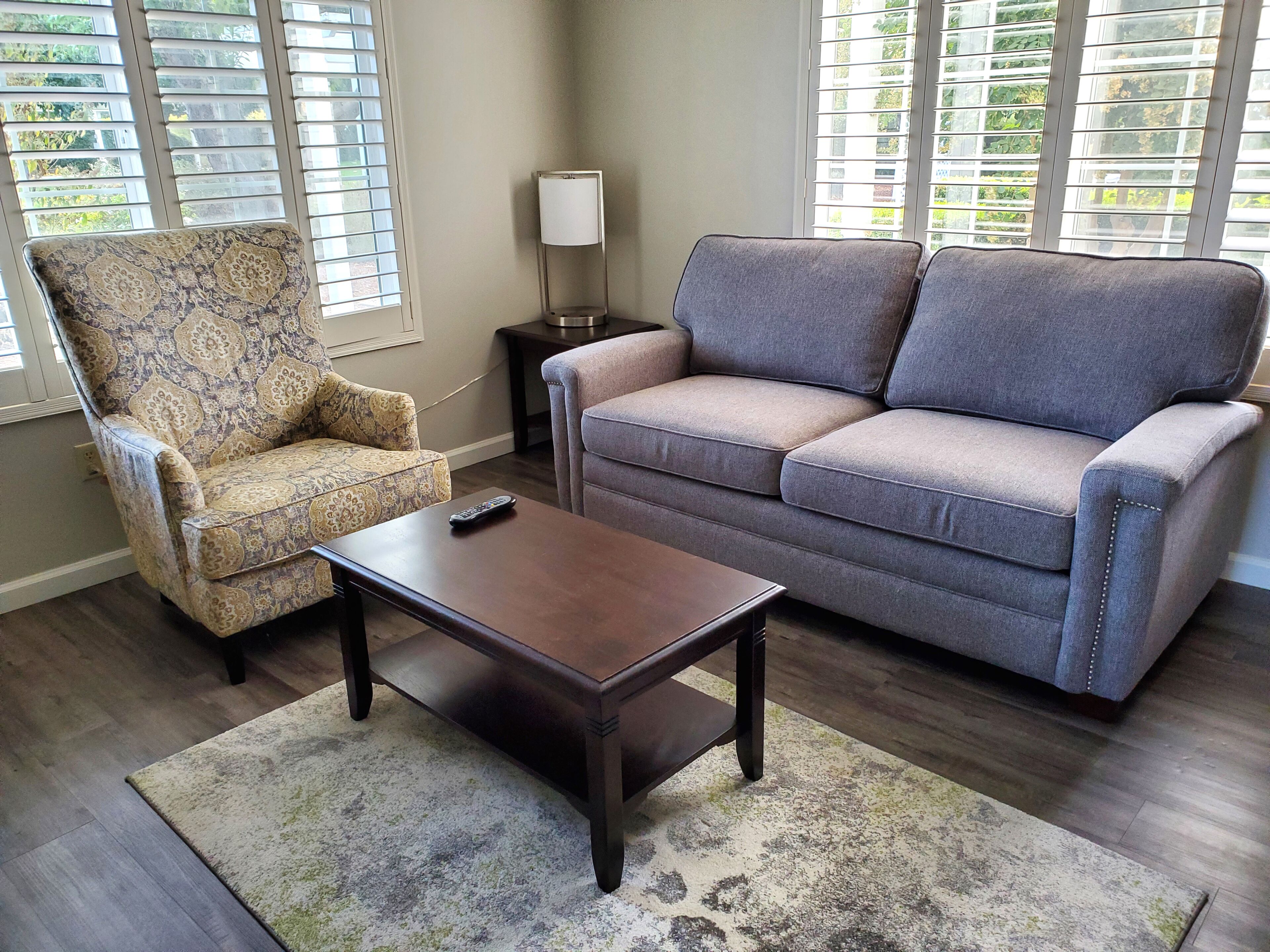 executive suite, 1 king bed with sofa bed, vineyard view | living room | 50-inch tv with cable channels