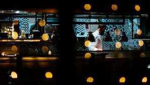 A bar area with patterned walls and hanging lights. - Latroupe Jacobs Inn (Dublin)