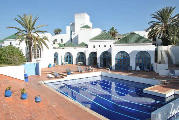Outdoor pool, open 9:00 AM to 7:00 PM, pool umbrellas, pool loungers