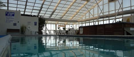 Indoor pool, seasonal outdoor pool, open 9 AM to 11 PM, pool loungers