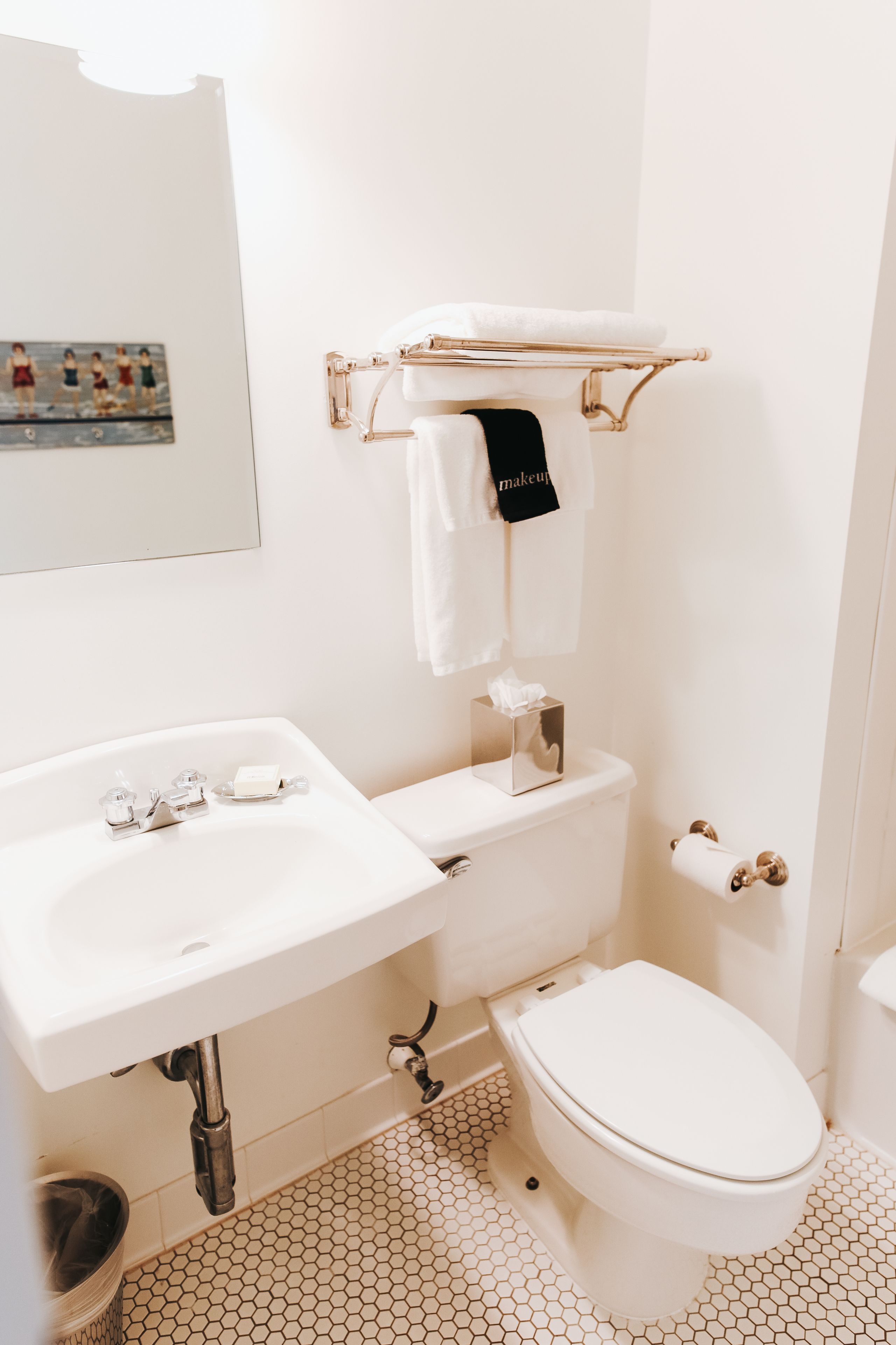 designer toiletries, hair dryer, towels