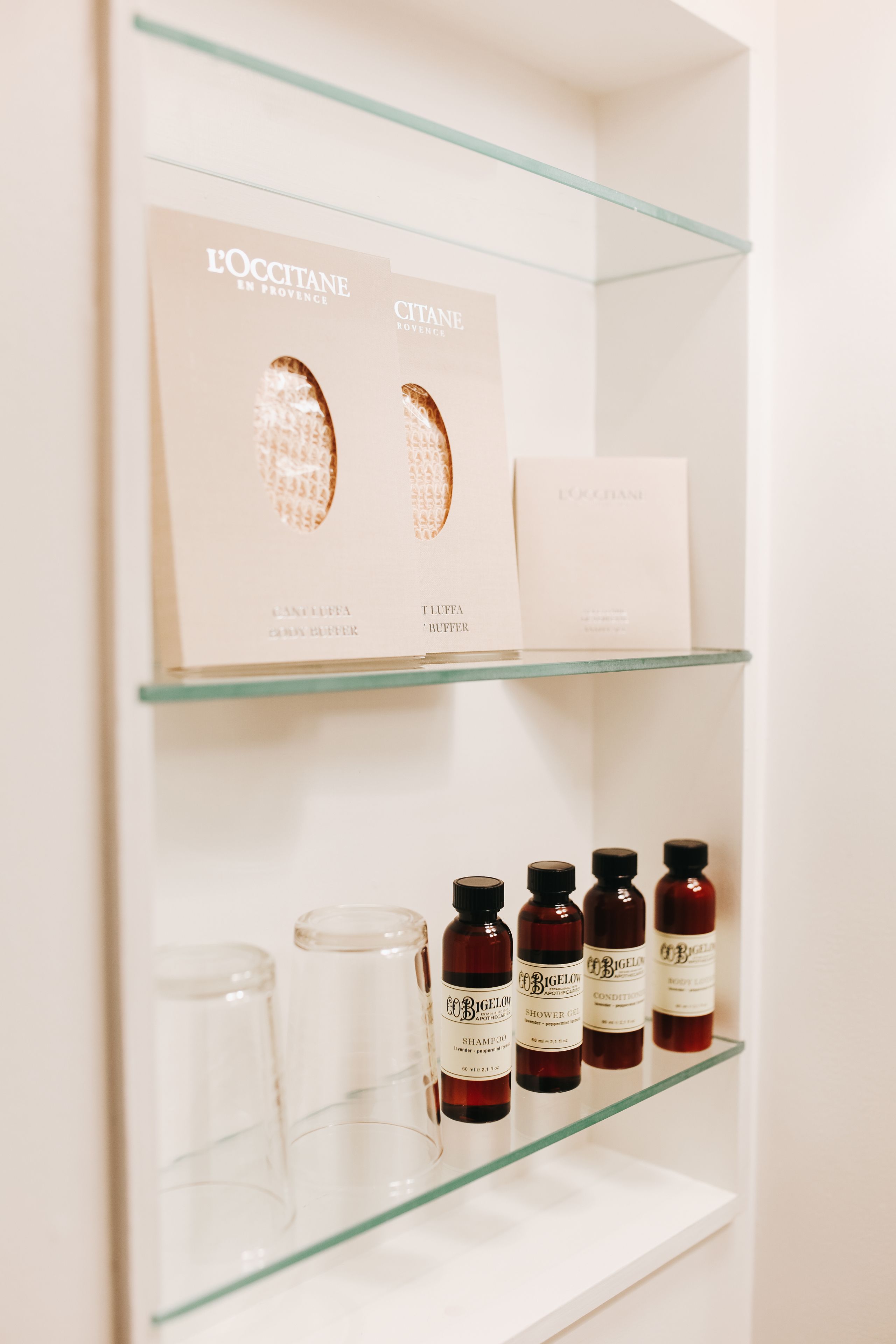 designer toiletries, hair dryer, towels