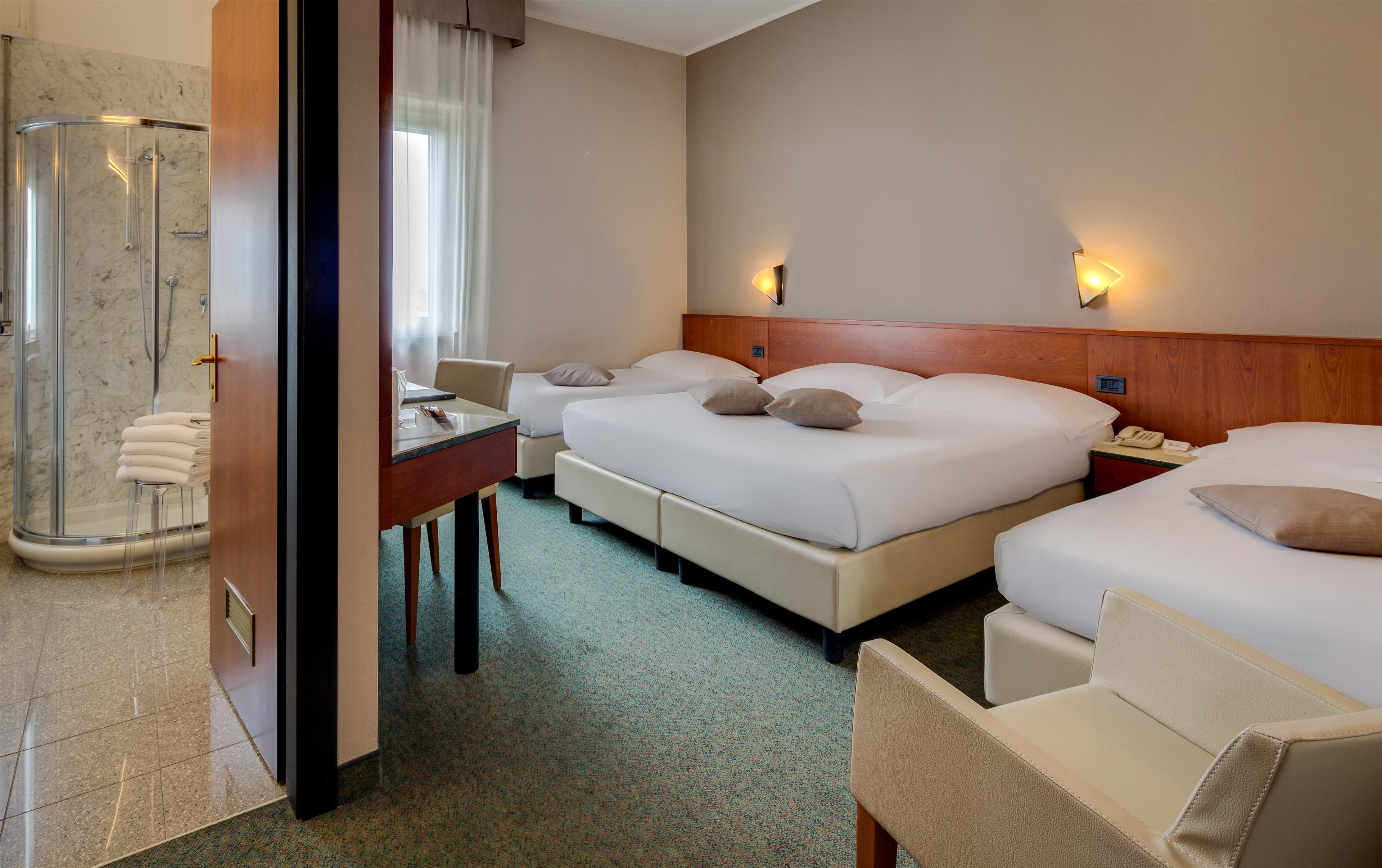 family room, multiple beds | frette italian sheets, premium bedding, down duvets, pillow-top beds