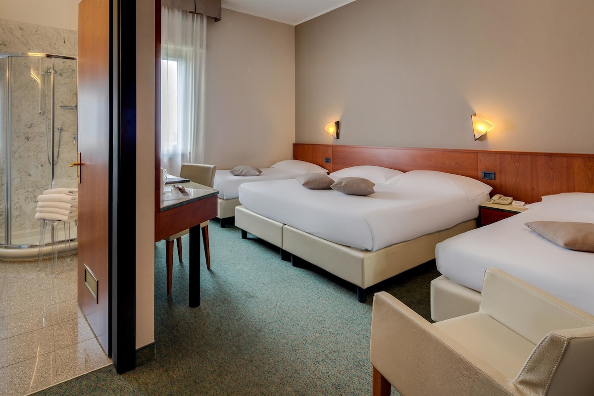 family room, multiple beds | frette italian sheets, premium bedding, down duvets, pillow-top beds