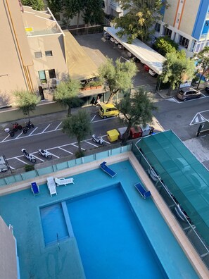 Outdoor pool, open 9:00 AM to 7:30 PM, pool loungers