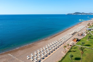 On the beach, beach cabanas, sun-loungers, beach umbrellas
