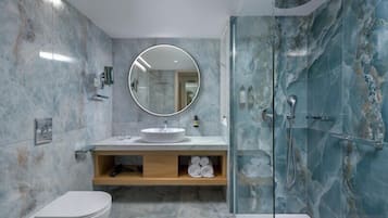 Eco-friendly toiletries, hair dryer, slippers, towels