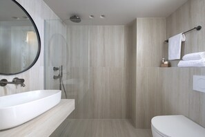 A modern bathroom with a large sink, a toilet, and a shower area. - Argile Resort  (Kefalonia)