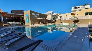 Outdoor pool, pool umbrellas, pool loungers