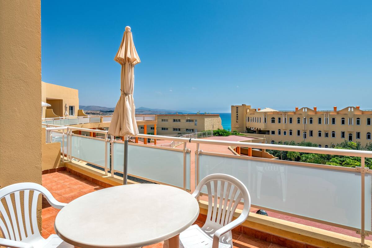 Apartment, 1 Bedroom, Sea View | 1 bedroom, blackout drapes, iron/ironing board (on request)