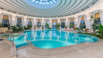 Indoor pool, seasonal outdoor pool, pool umbrellas, pool loungers