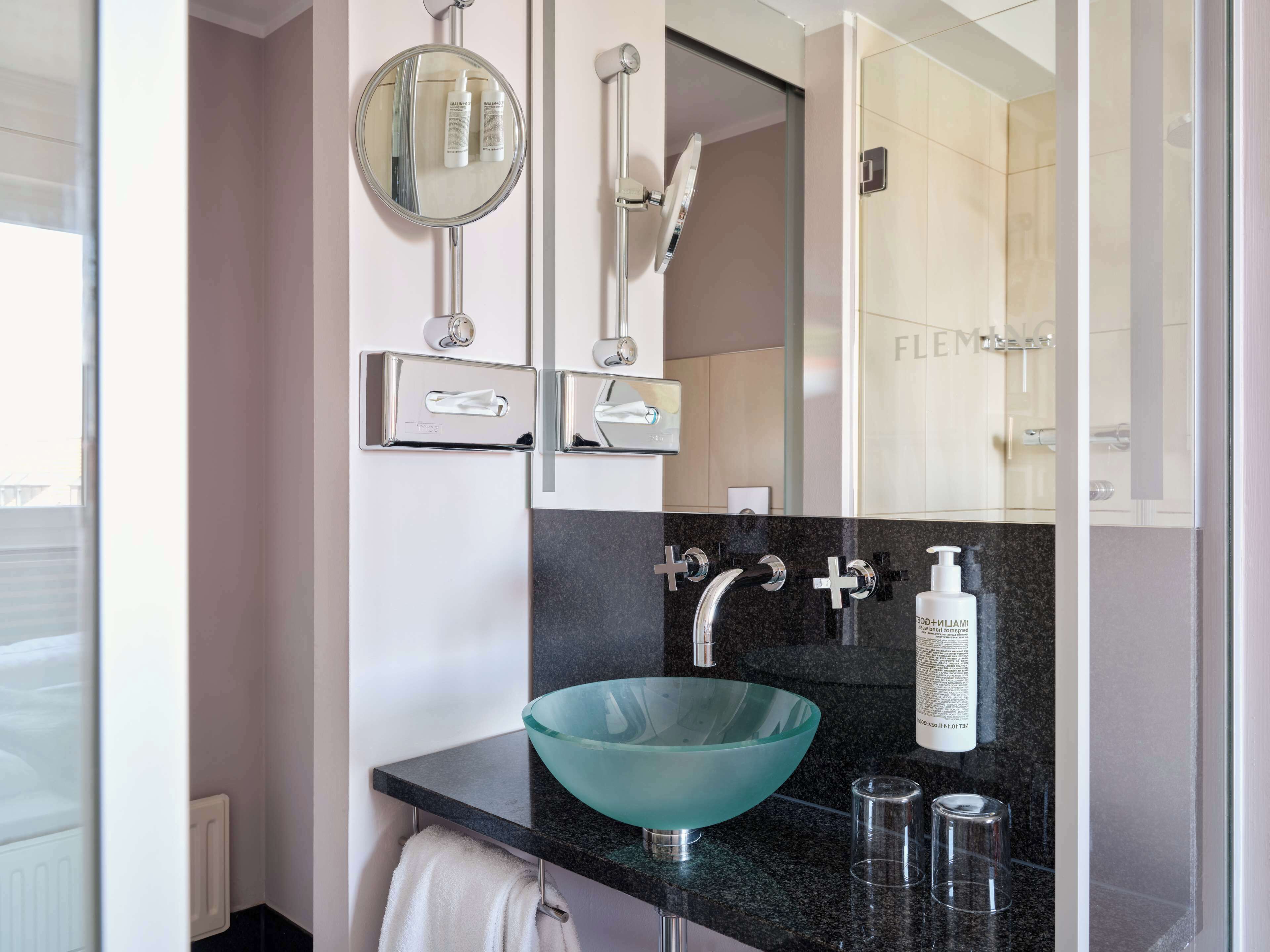 shower, designer toiletries, hair dryer, towels