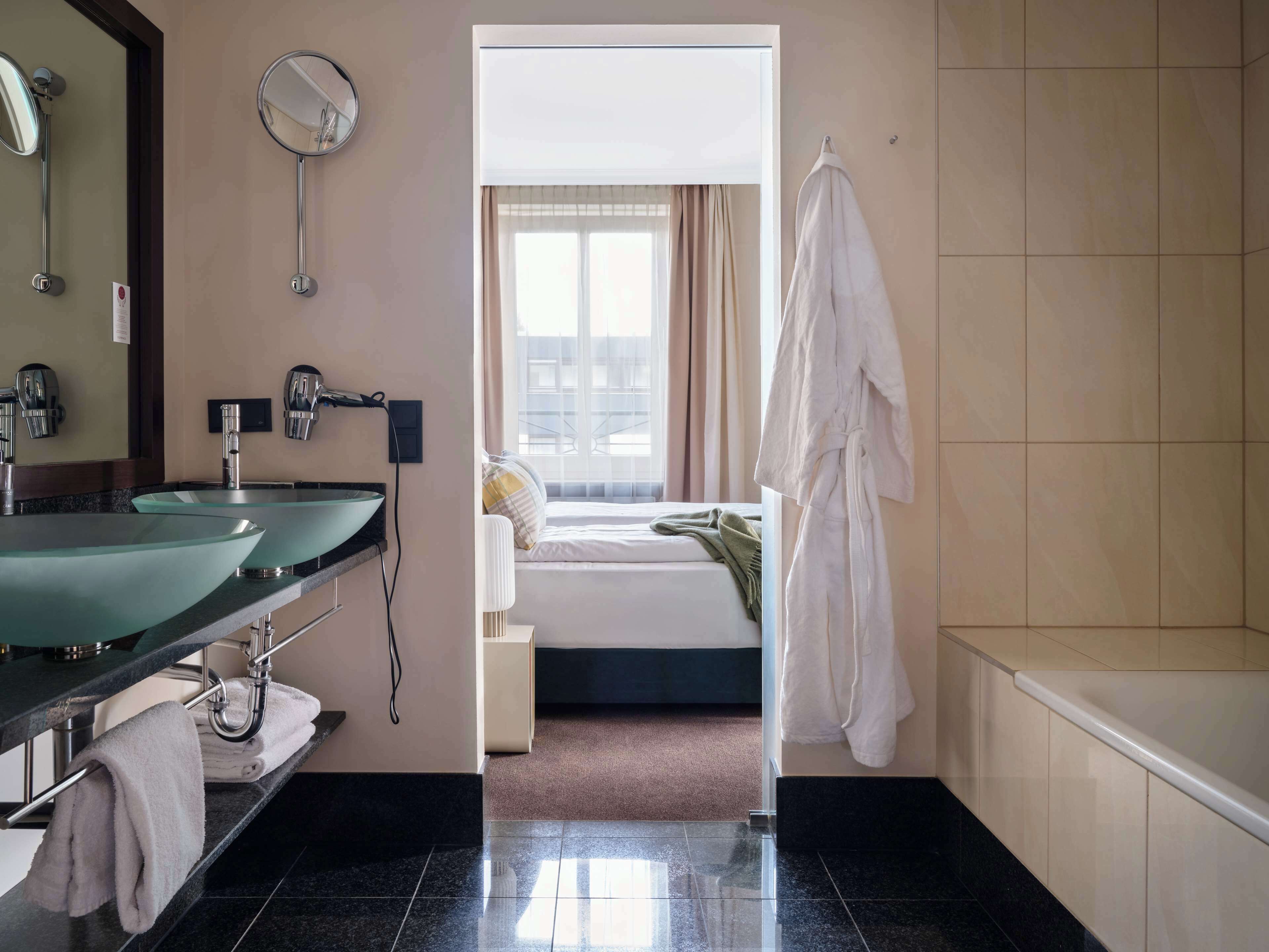 signature suite | bathroom | shower, designer toiletries, hair dryer, towels