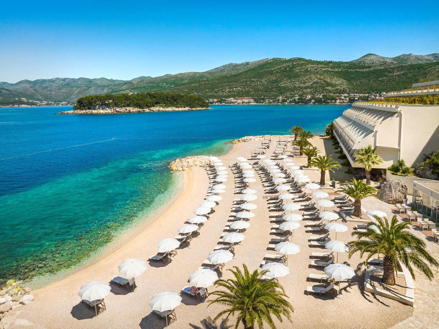 On the beach, sun loungers, beach umbrellas, beach towels