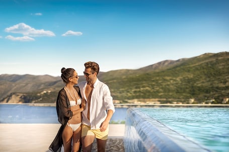 Indoor pool, seasonal outdoor pool, pool umbrellas, sun loungers. President Hotel, Valamar Collection
