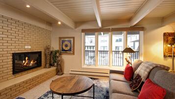 Deluxe Condo, 2 Bedrooms, Fireplace (Chateau Dumont 11) | Living area | Flat-screen TV, fireplace