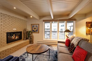 Deluxe Condo, 2 Bedrooms, Fireplace (Chateau Dumont 11) | Living area | Flat-screen TV, fireplace